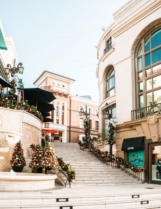 Rodeo drive grand stairs near Maison 140 during the winter holidays on a bright overcast day.